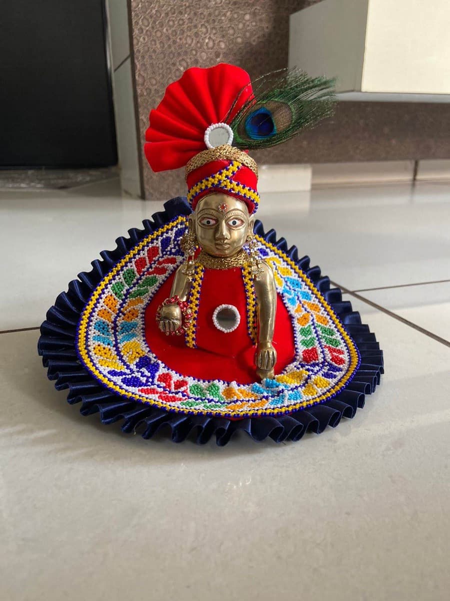 Beaded Laddu Gopal vagha with colourful patterns on display