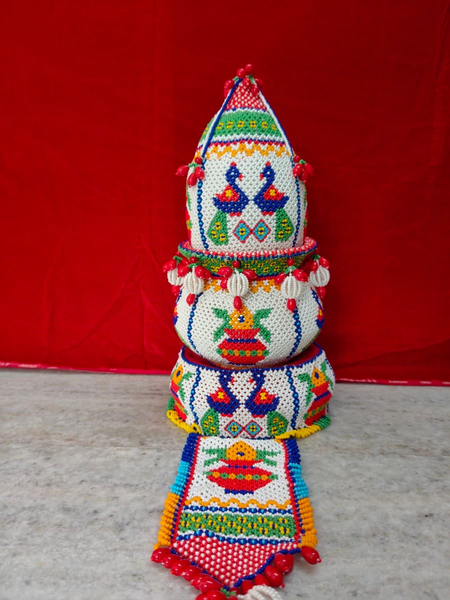 Moti bharat loti shrifal with vibrant beadwork, peacock motifs, and matching beaded runner