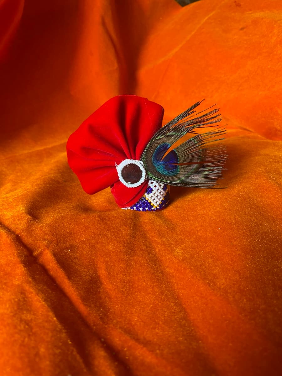 Beaded Laddu Gopal vagha with colourful bead patterns